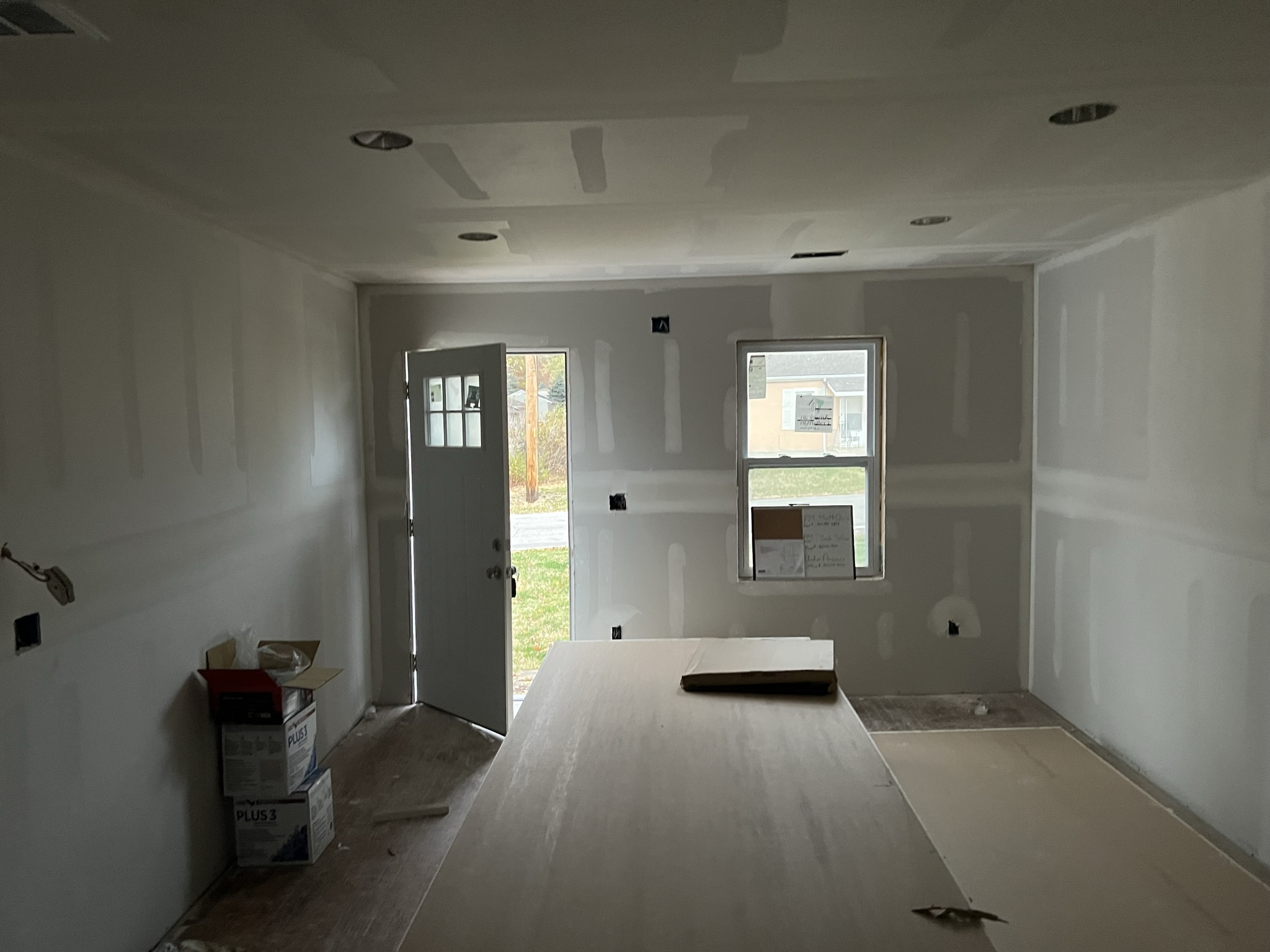 Front entry room with fresh drywall and taped seams